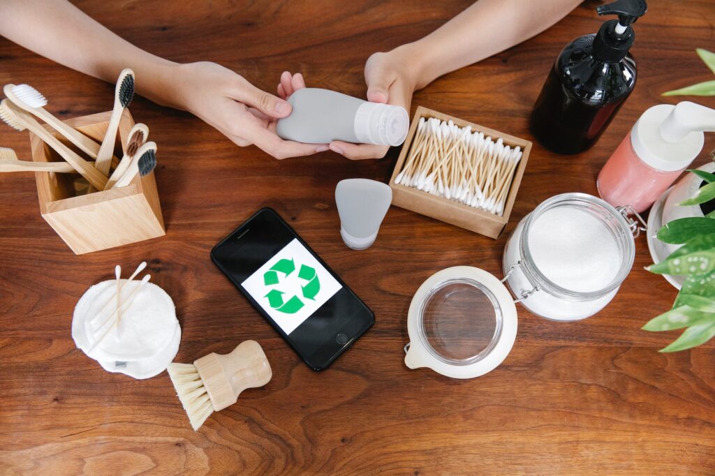 crop person taking recycling tube of cosmetics